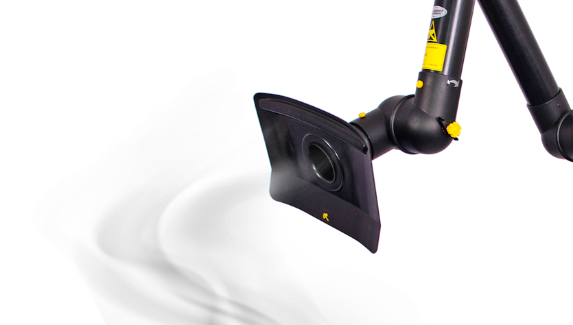 Black flat-top hood mointed on an extraction arm sucks finest particles in