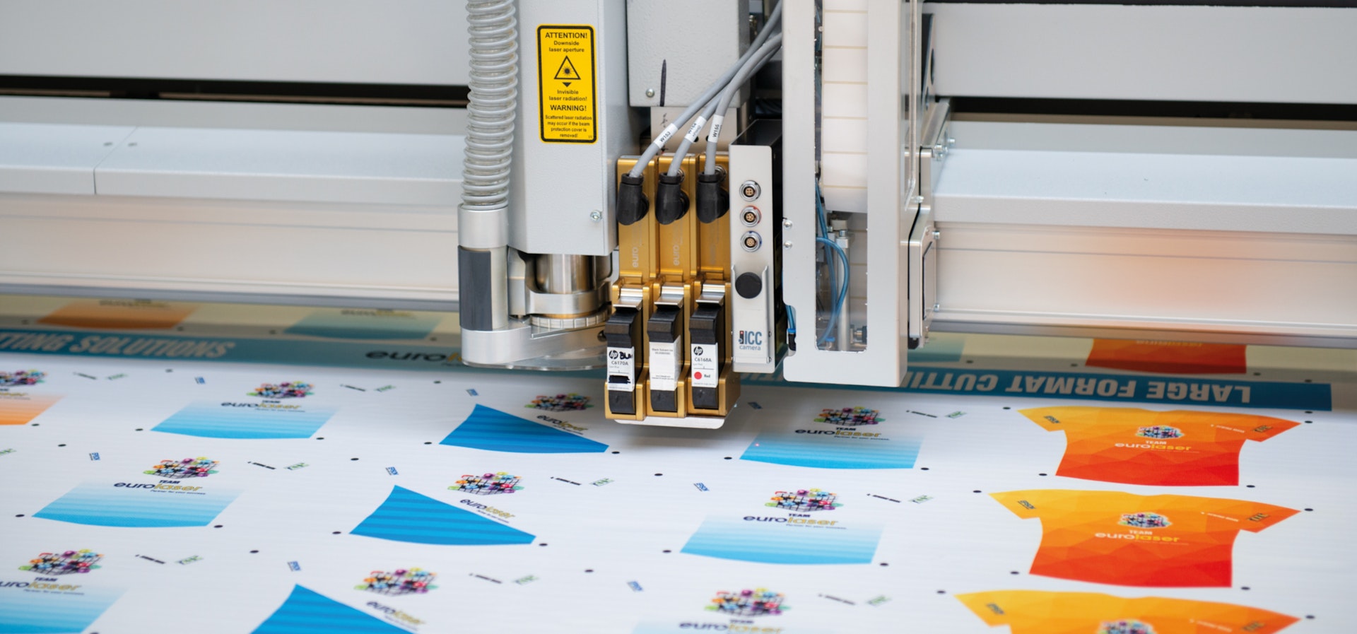 A laser is cutting synthetic clothes