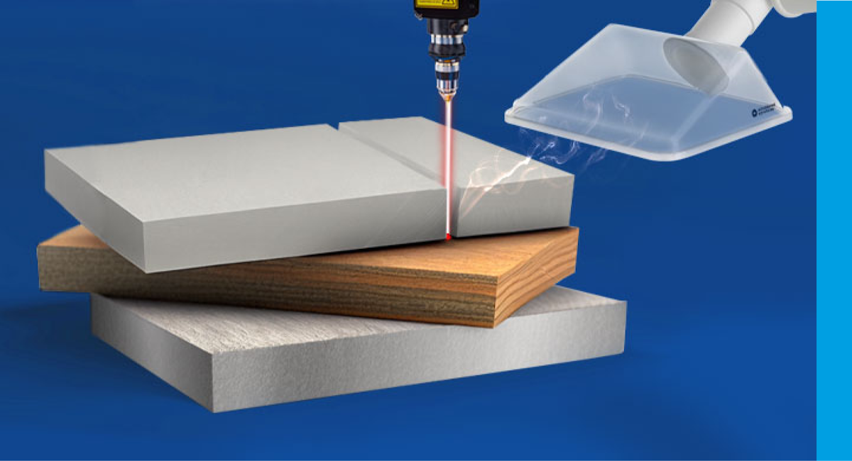 A laser beam processes several materials next to a suction funnel