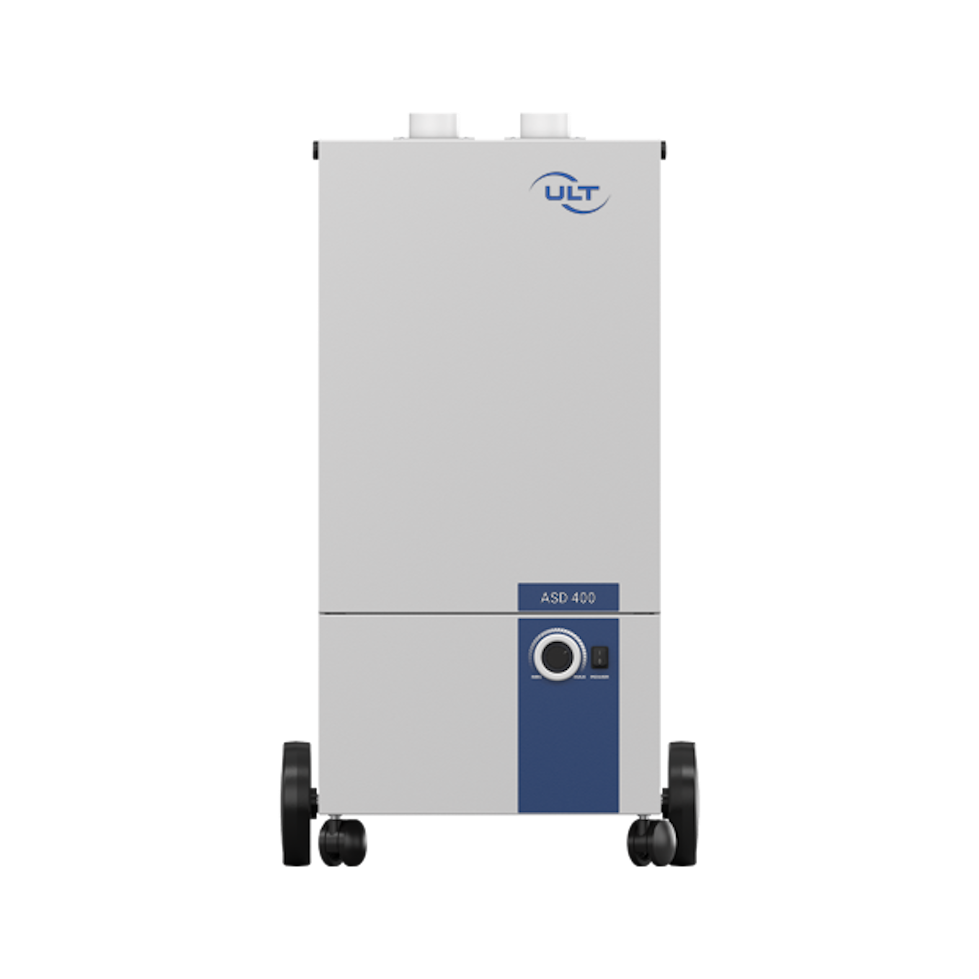 Front view of the gray device with blue sticker and wheels